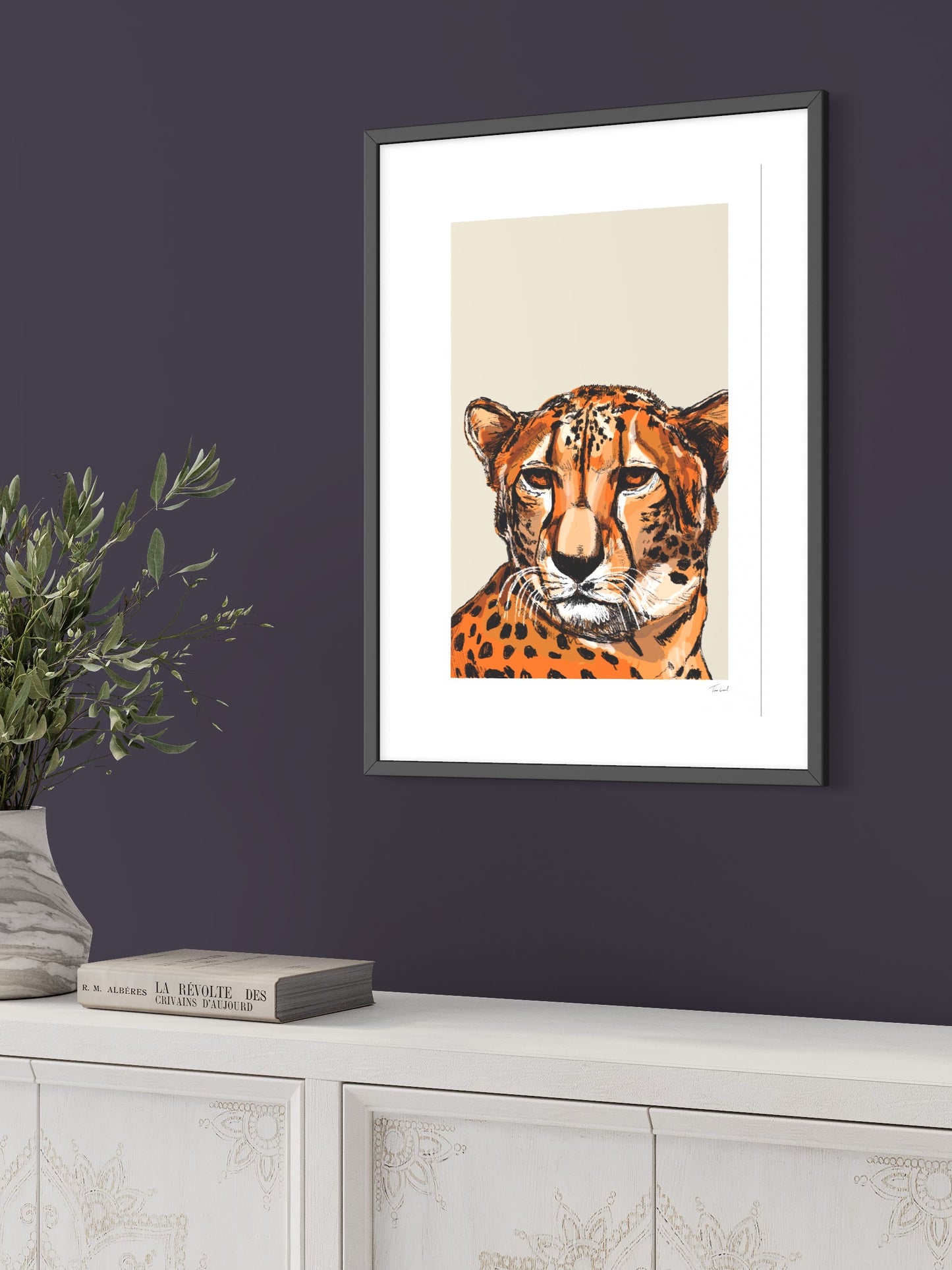 This image shows a giclee wall art print by Tom Laird Illustration of a Cheetah, framed in a beautiful living room with tasteful modern home decor. This art print is available from Tom Laird Illustration in various sizes.