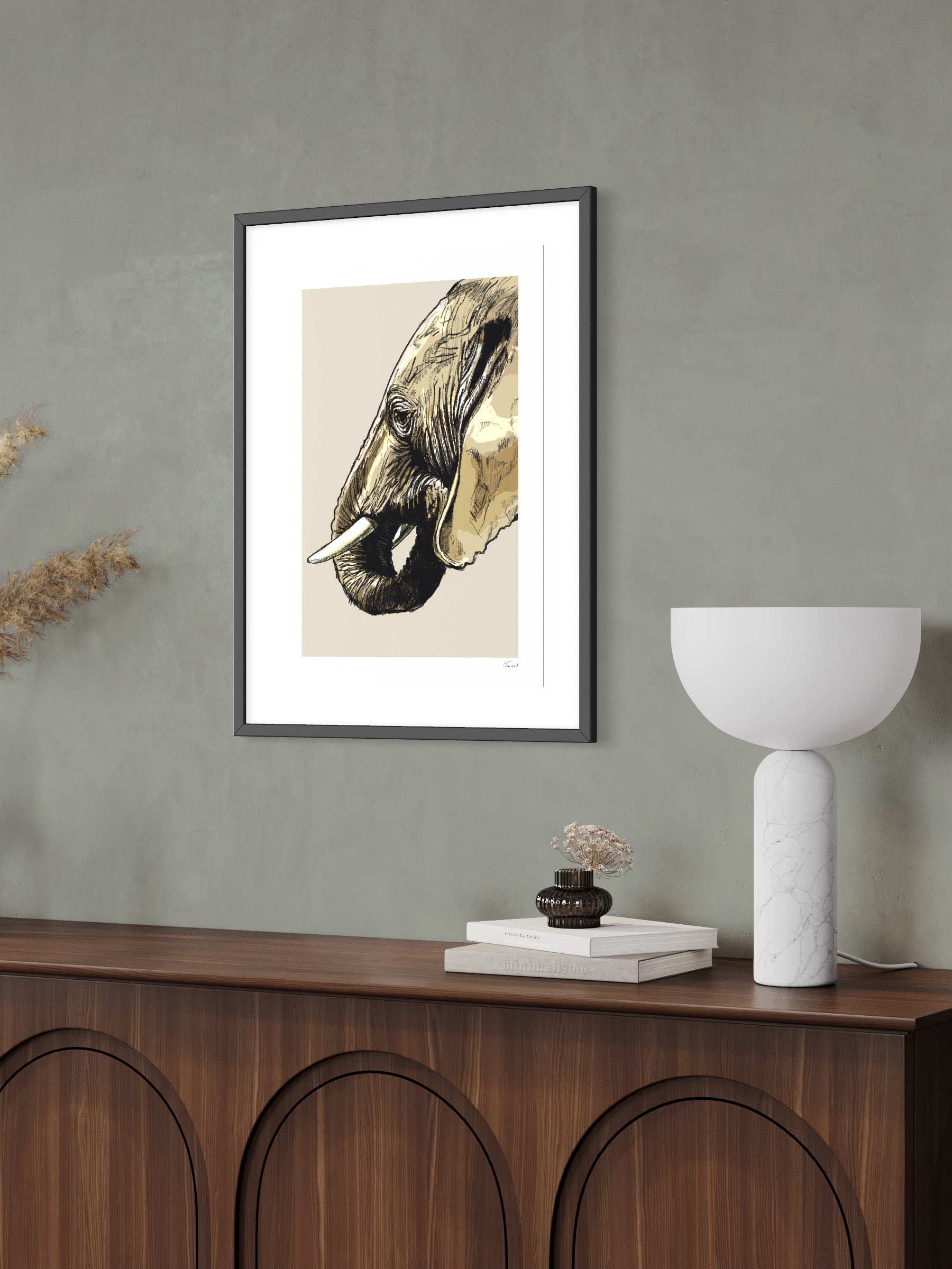 This image shows a giclee wall art print by Tom Laird Illustration of an Elephant, framed in a beautiful living room with tasteful modern home decor. This art print is available from Tom Laird Illustration in various sizes.