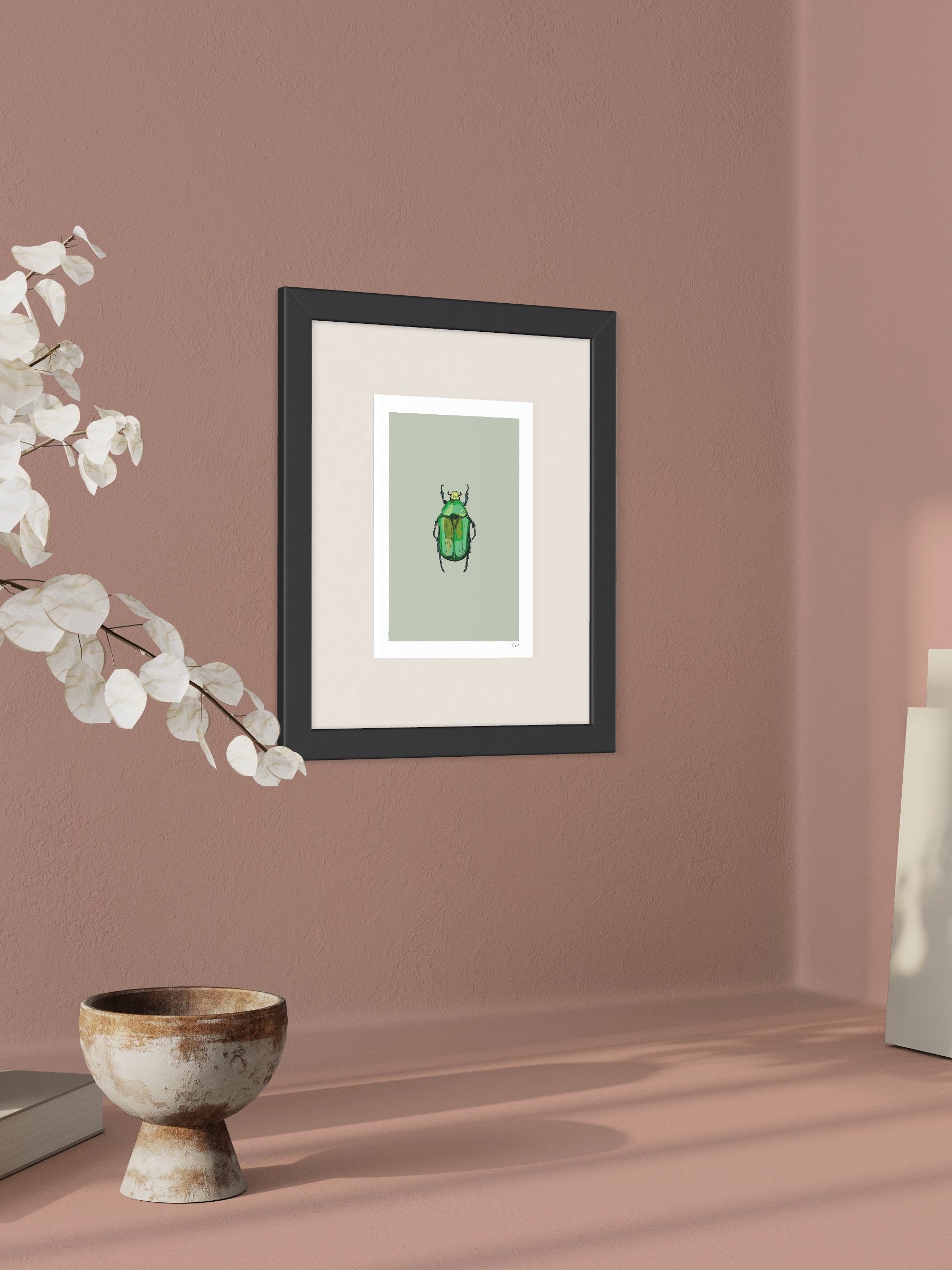 This image shows a giclee wall art print by Tom Laird Illustration of a Rose Chafer Beetle, framed in a beautiful living room with tasteful modern home decor. This art print is available from Tom Laird Illustration in various sizes.