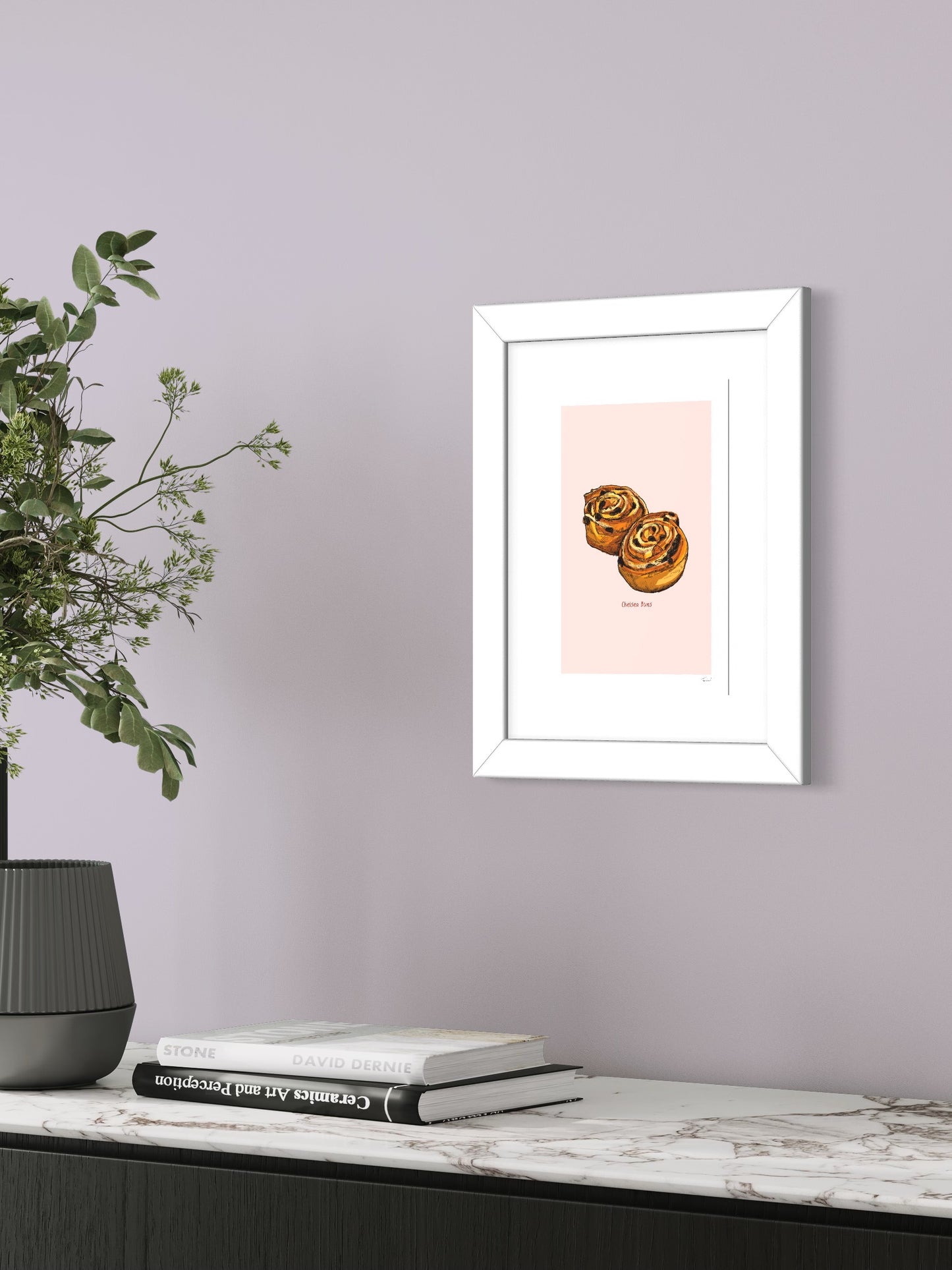 This image shows a giclee wall art print by Tom Laird Illustration of Chelsea Buns, framed in a beautiful living room with tasteful modern home decor. This art print is available from Tom Laird Illustration in various sizes.