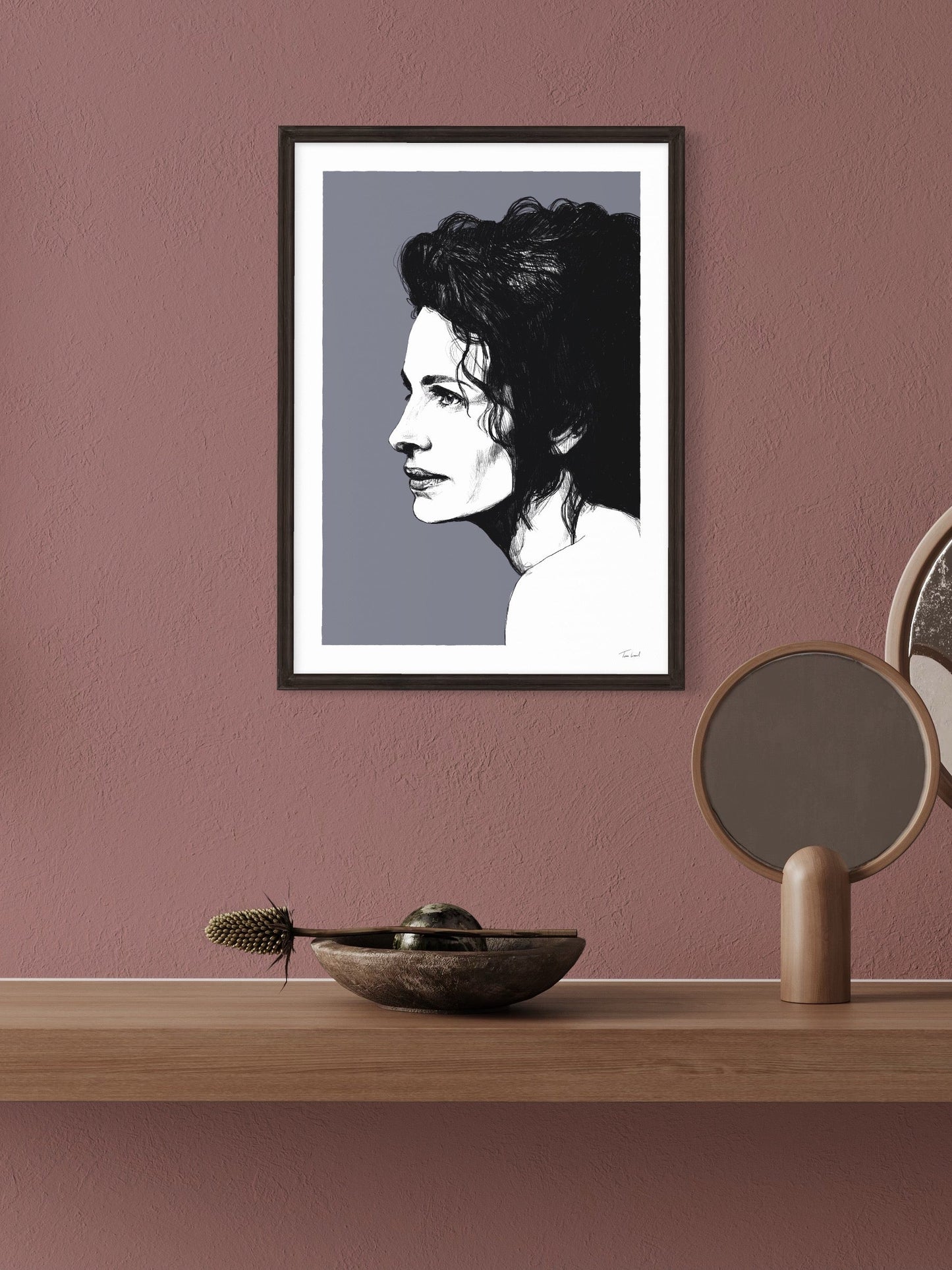 This image shows a giclee wall art print by Tom Laird Illustration of the iconic Pretty Woman actor Julia Roberts, framed in a beautiful room with tasteful modern home decor. This art print is available from Tom Laird Illustration in various sizes.