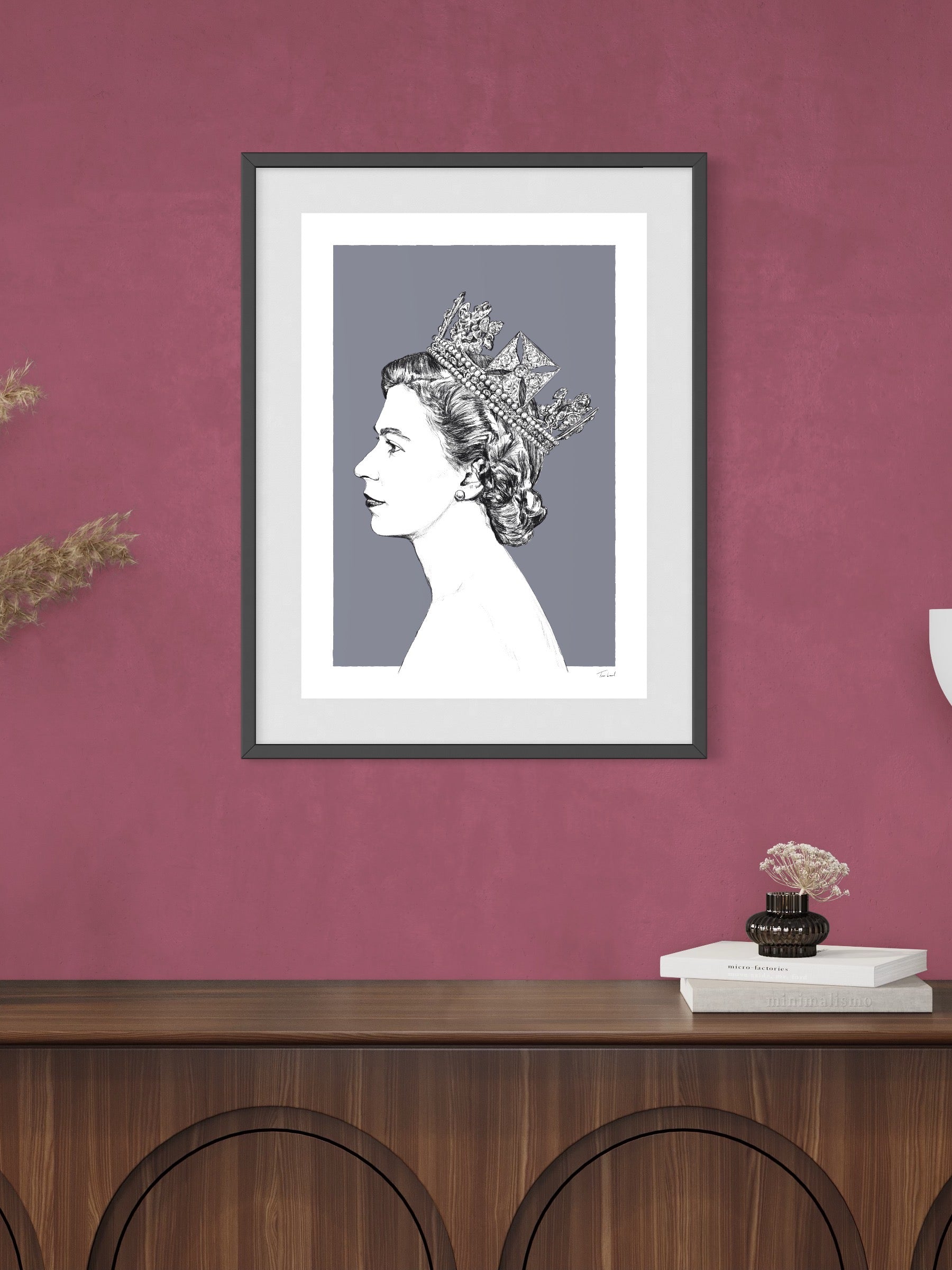 This image shows a giclee wall art print by Tom Laird Illustration of the late Queen Elizabeth II, framed in a beautiful room with tasteful modern home decor. This art print is available from Tom Laird Illustration in various sizes.