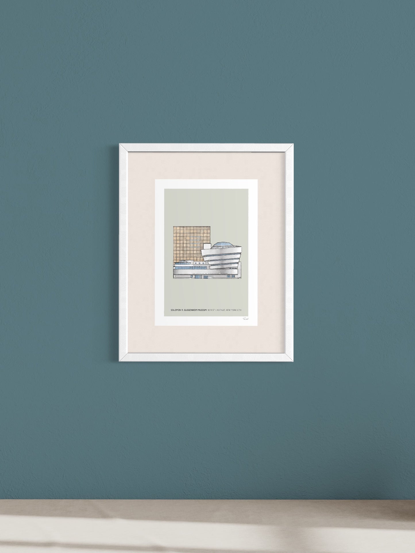 This image shows a giclee wall art print by Tom Laird Illustration of the world-famous New York City landmark the Guggenheim Museum, framed in a beautiful living room with tasteful modern home decor. This art print is available from Tom Laird Illustration in A4 size.